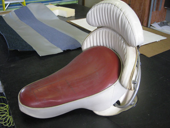Motorcycle seat in need of repair.